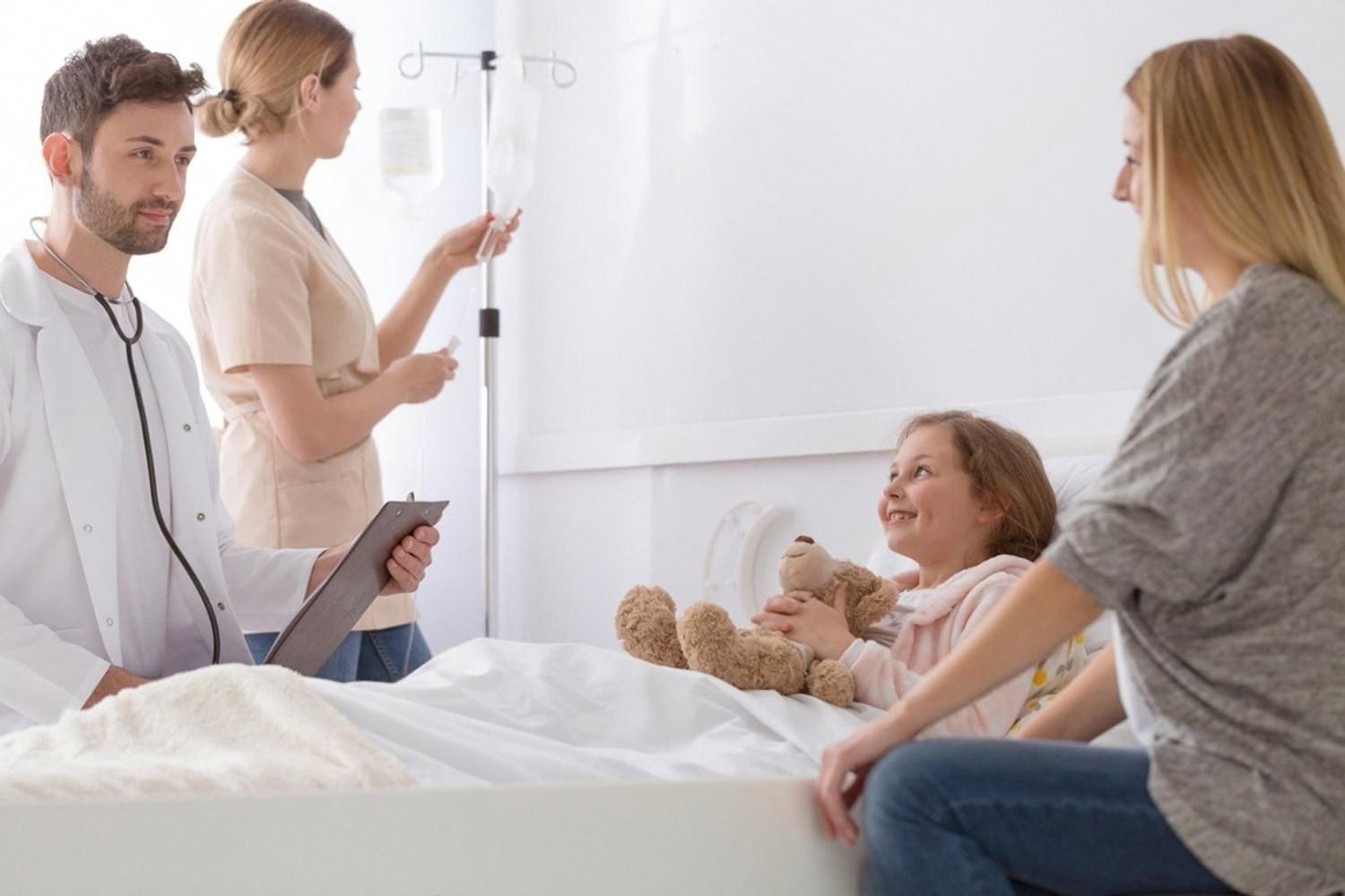 Medical team attending to a young patient in a hospital room after routed check-in